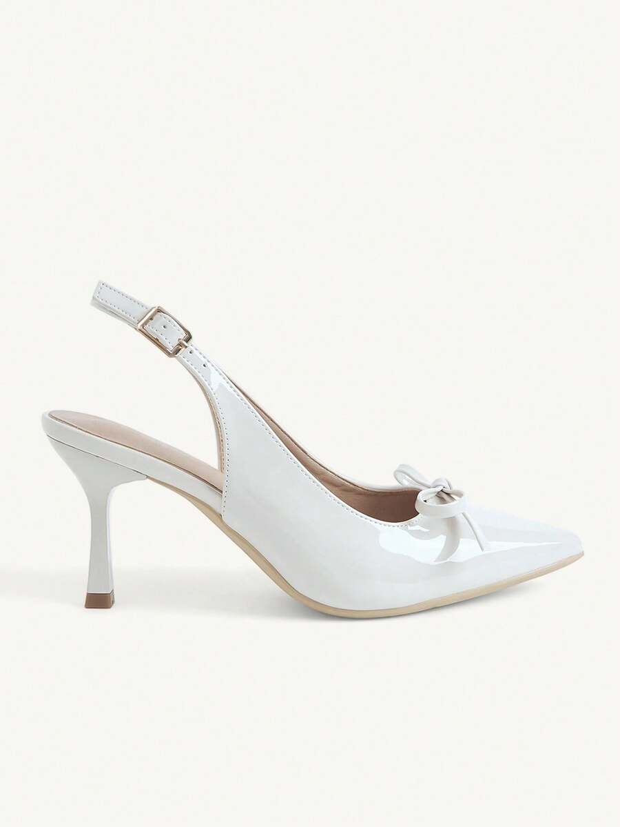 Beige pointed toe high heel pumps featuring a sleek stiletto heel and slingback strap for women.