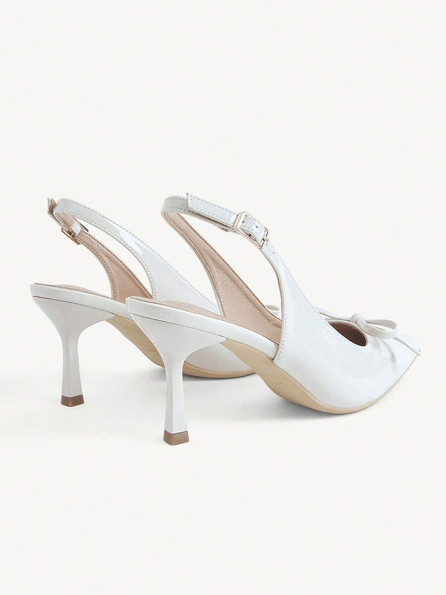 Beige pointed toe high heel pumps featuring a sleek stiletto heel and slingback strap for women.