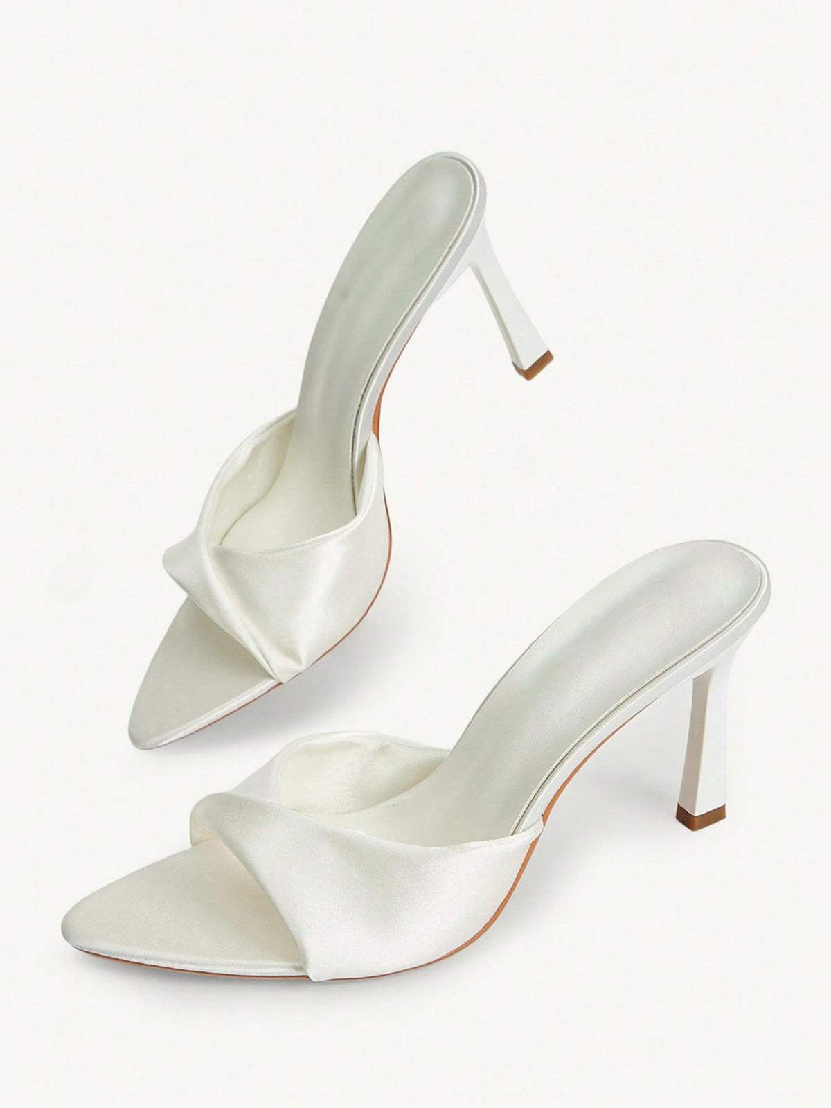 Women's peep toe high-heeled stiletto sandals with slingback strap in light metallic finish.