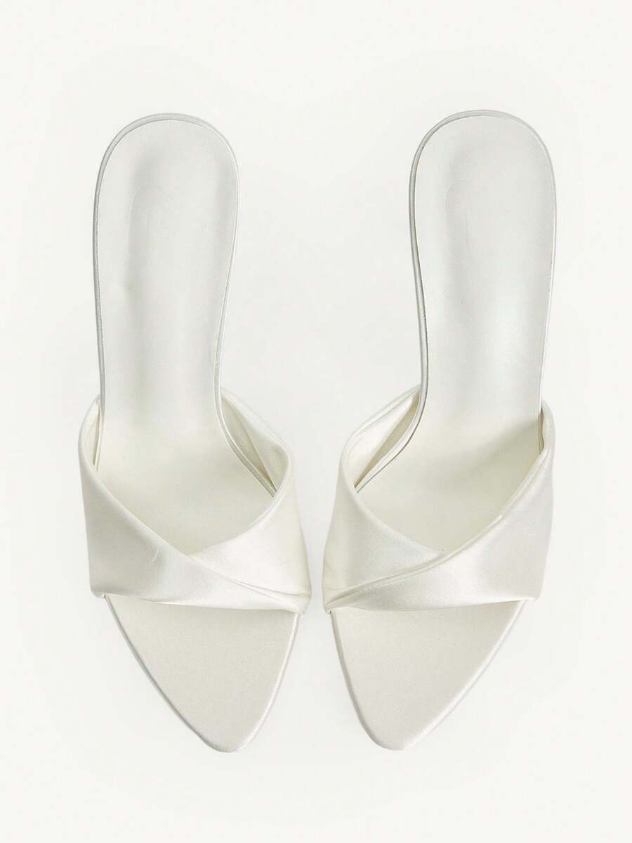 Women's peep toe high-heeled stiletto sandals with slingback strap in light metallic finish.