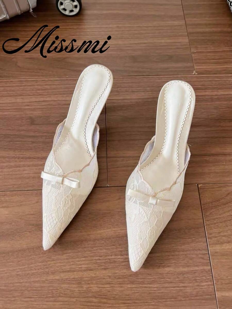 Lace pointed toe stiletto heel sandal pumps featuring mesh detailing, high slender heels, and an adjustable ankle buckle strap.