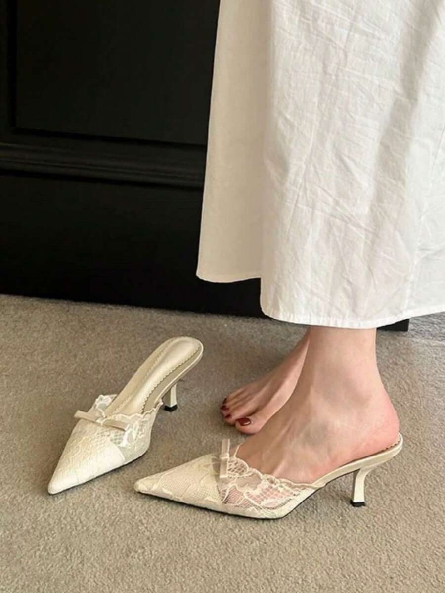 Lace pointed toe stiletto heel sandal pumps featuring mesh detailing, high slender heels, and an adjustable ankle buckle strap.