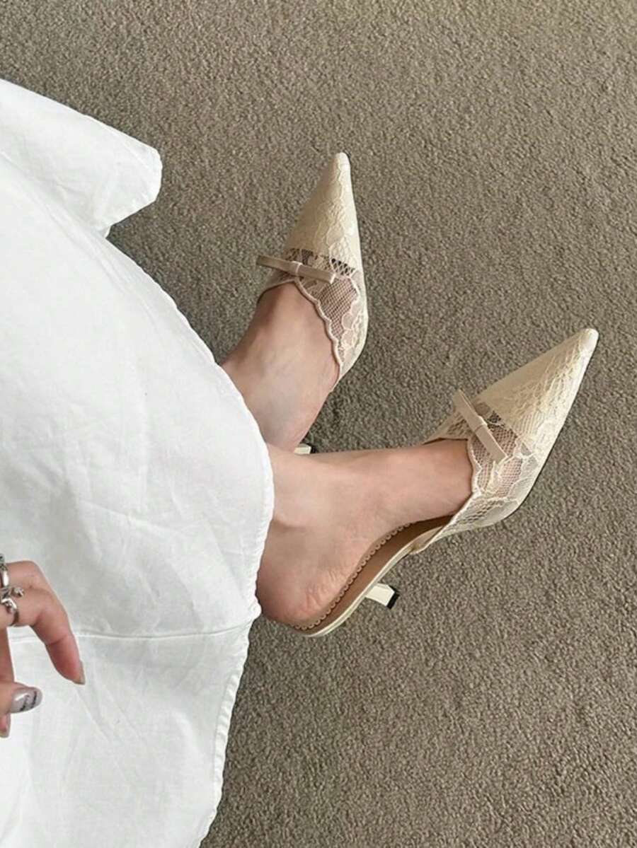 Lace pointed toe stiletto heel sandal pumps featuring mesh detailing, high slender heels, and an adjustable ankle buckle strap.
