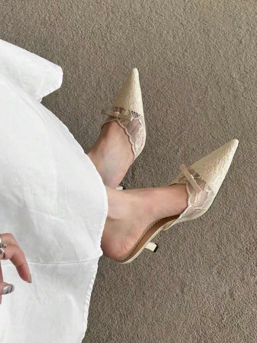 Lace pointed toe stiletto heel sandal pumps featuring mesh detailing, high slender heels, and an adjustable ankle buckle strap.