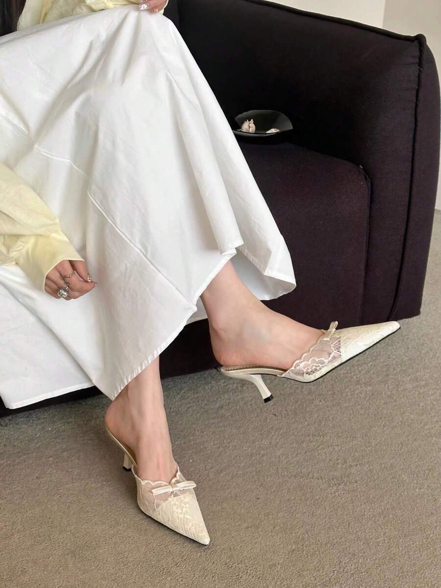 Lace pointed toe stiletto heel sandal pumps featuring mesh detailing, high slender heels, and an adjustable ankle buckle strap.