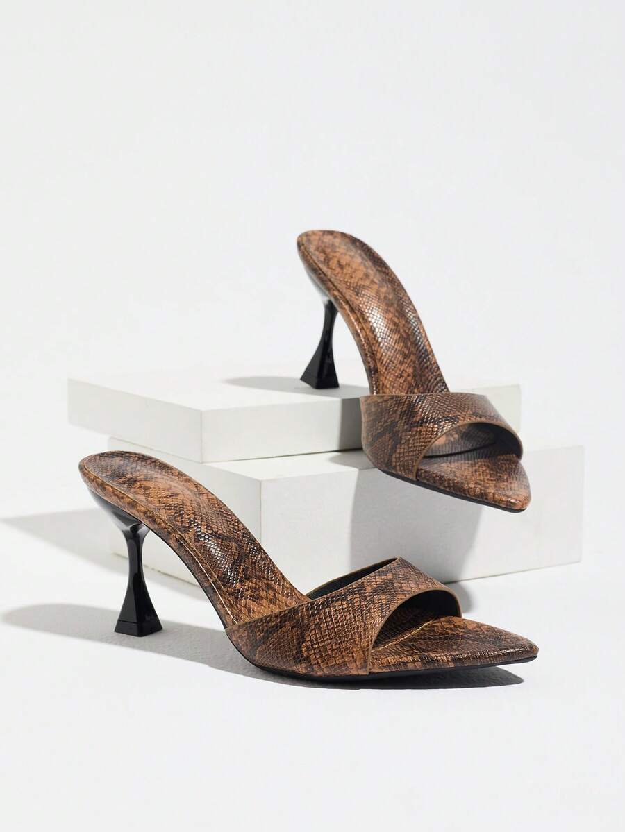 Women's pointed toe high heel mule sandals featuring a sleek slip-on design with elegant lace embroidery detailing