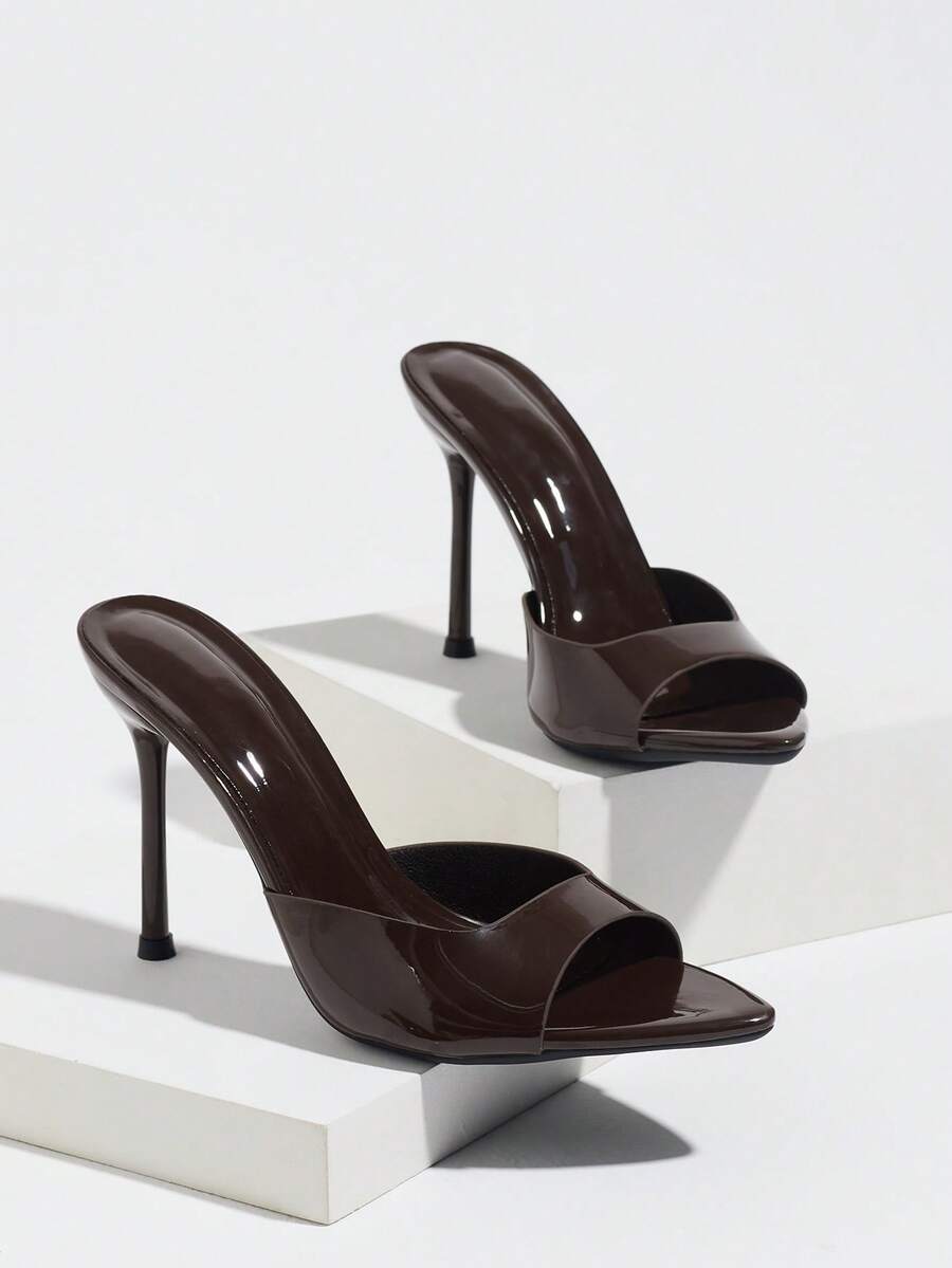 Women's coffee brown high heel mule shoes featuring a glossy mirror finish, open toe design, and sleek stiletto heel.