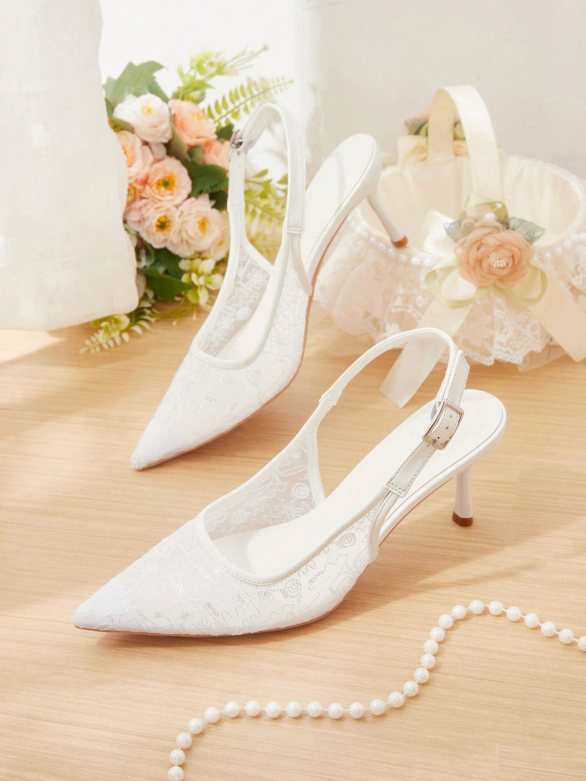 Pointed toe stiletto high heel pumps featuring black lace mesh upper, buckle slingback detail, and sleek slip-on design for weddings and evening wear.
