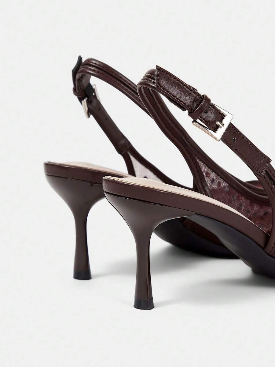 Pointed toe stiletto high heel pumps featuring black lace mesh upper, buckle slingback detail, and sleek slip-on design for weddings and evening wear.