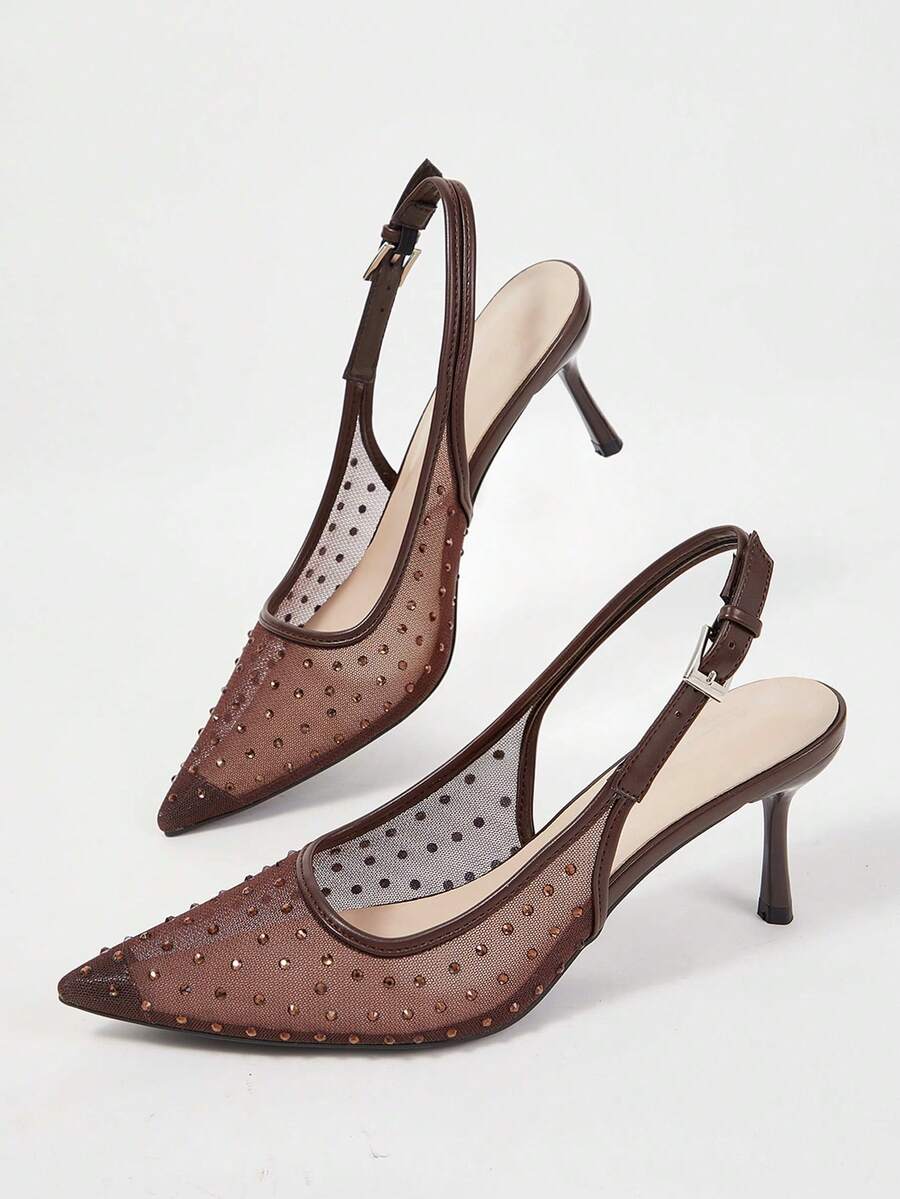 Pointed toe stiletto high heel pumps featuring black lace mesh upper, buckle slingback detail, and sleek slip-on design for weddings and evening wear.