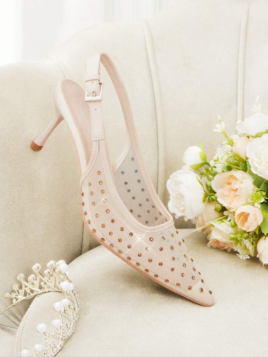 Pointed toe stiletto high heel pumps featuring black lace mesh upper, buckle slingback detail, and sleek slip-on design for weddings and evening wear.