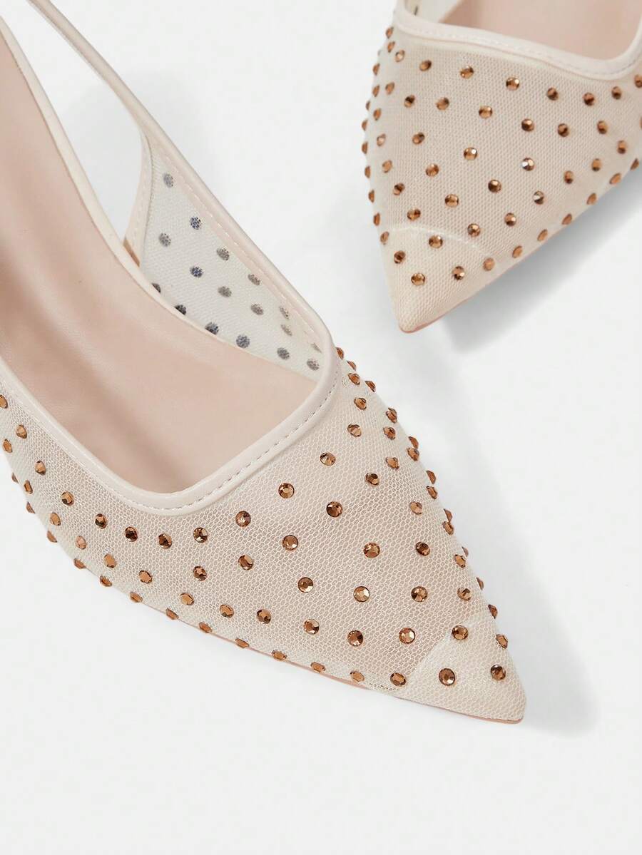 Pointed toe stiletto high heel pumps featuring black lace mesh upper, buckle slingback detail, and sleek slip-on design for weddings and evening wear.