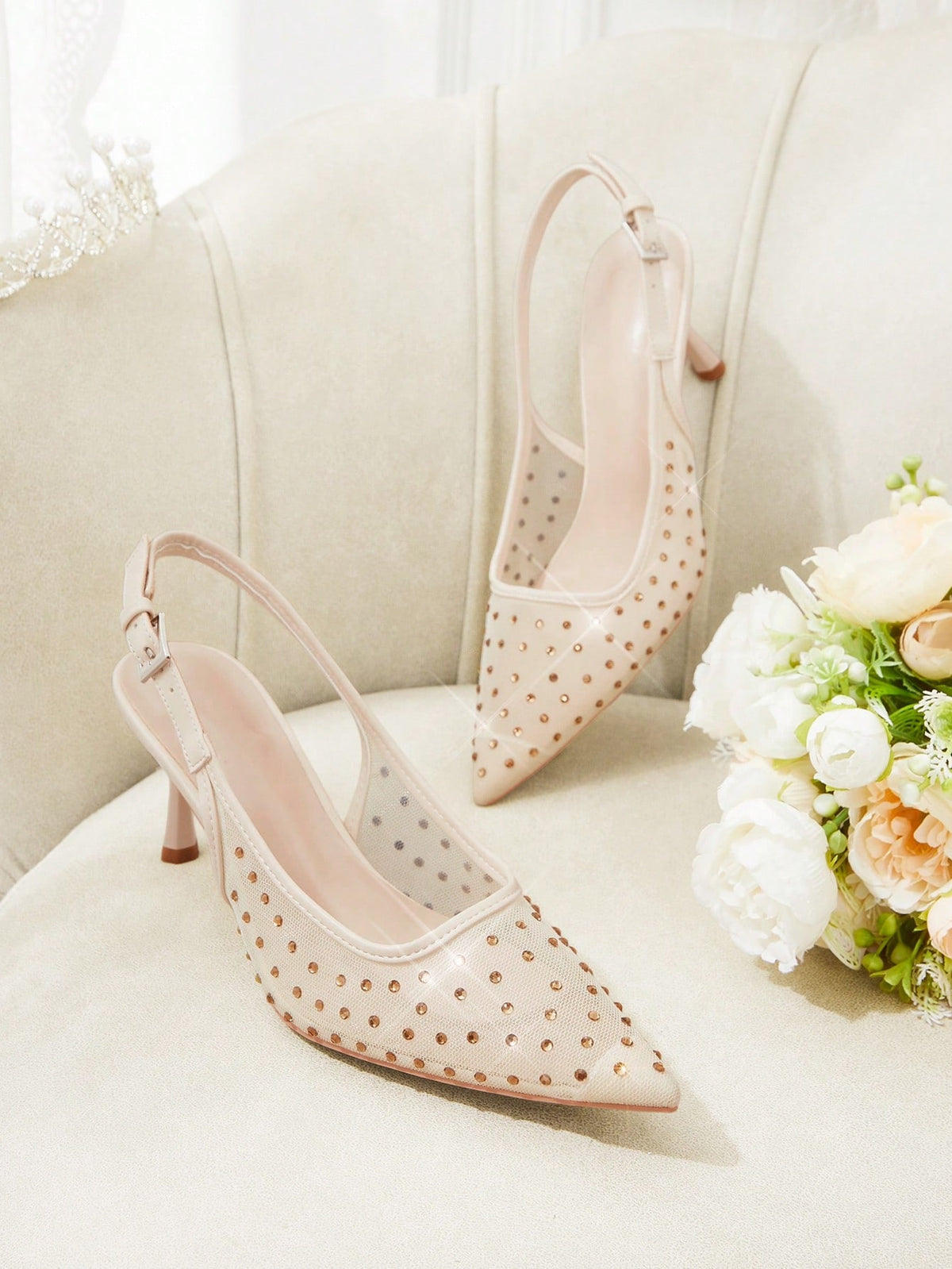 Pointed toe stiletto high heel pumps featuring black lace mesh upper, buckle slingback detail, and sleek slip-on design for weddings and evening wear.