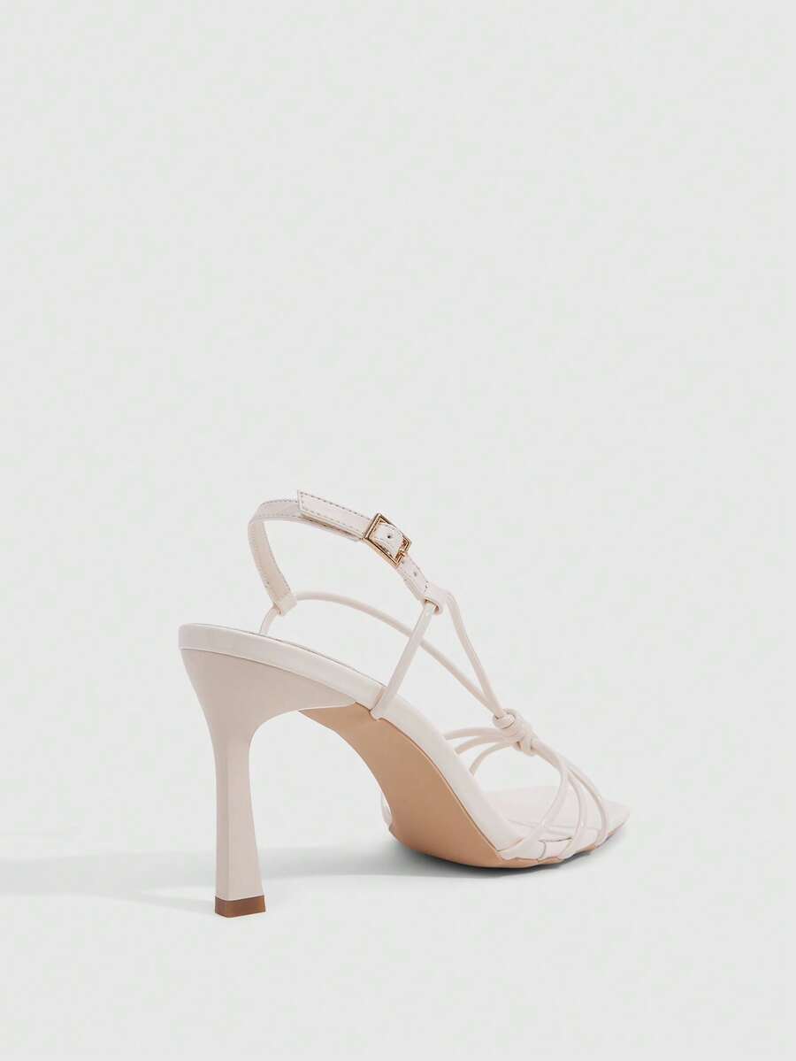 Women's square toe stiletto heel slingback sandals featuring sleek straps and buckle closure in a backless design.