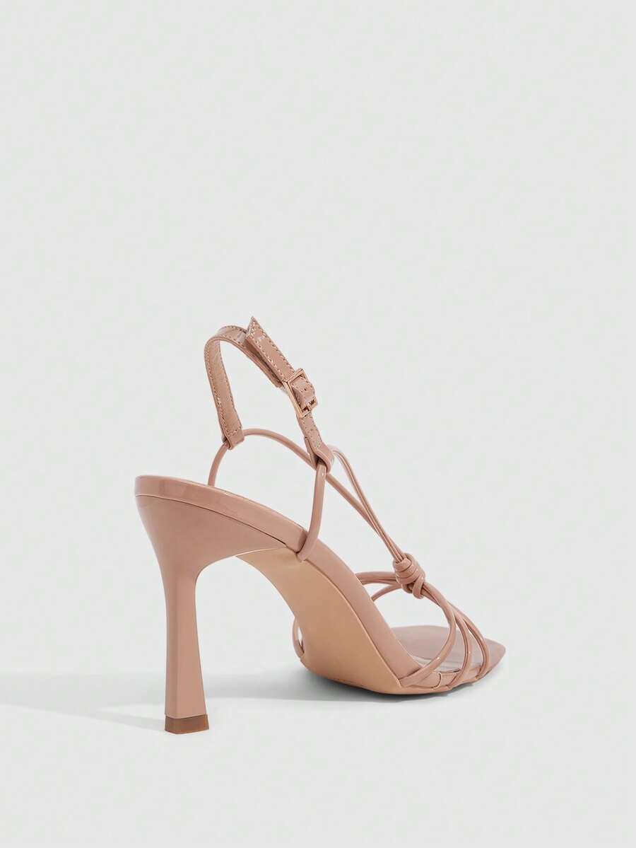 Women's square toe stiletto heel slingback sandals featuring sleek straps and buckle closure in a backless design.
