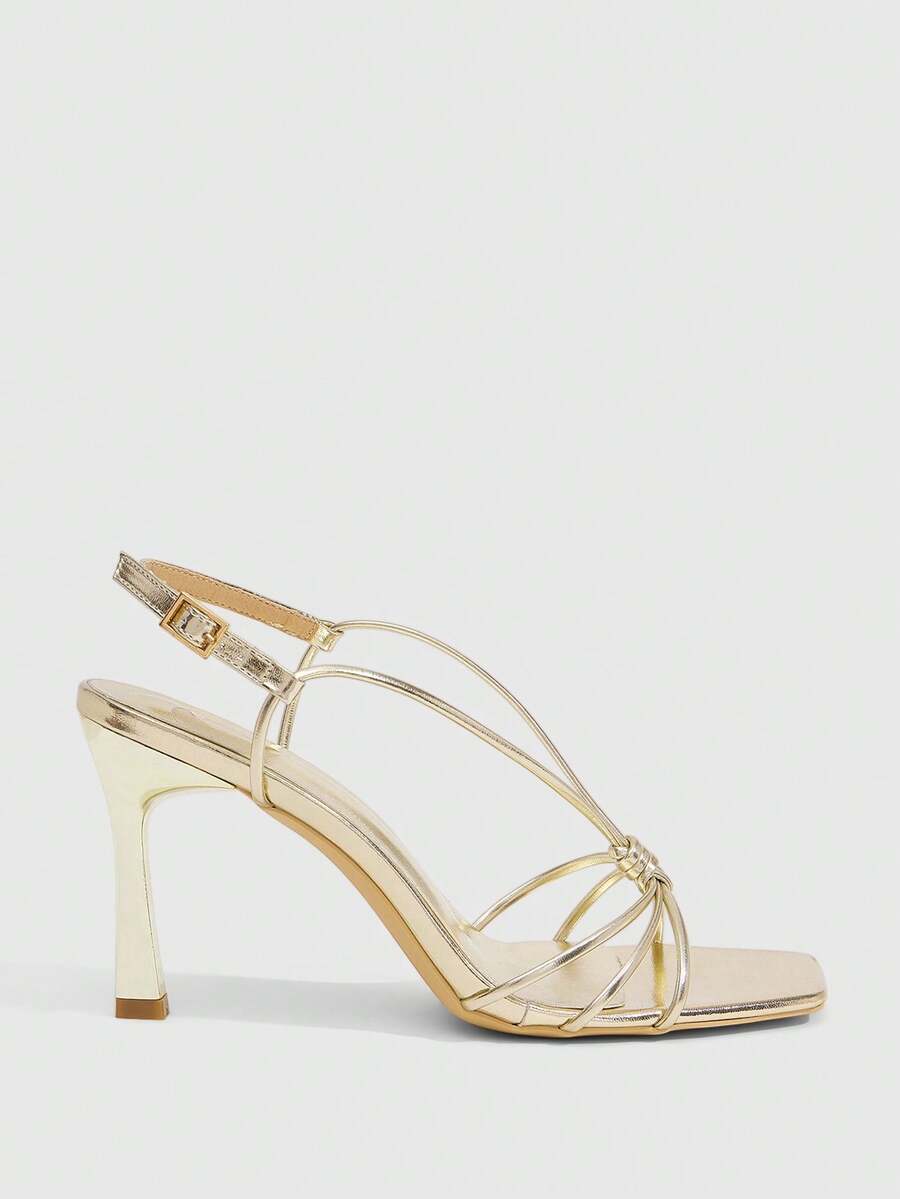 Women's square toe stiletto heel slingback sandals featuring sleek straps and buckle closure in a backless design.