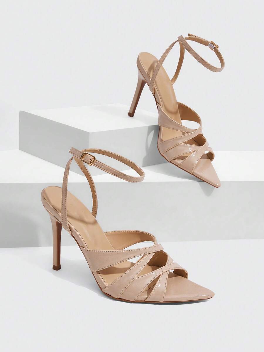 Women's open toe high stiletto sandals with cut-out cross straps and adjustable ankle buckle closure.