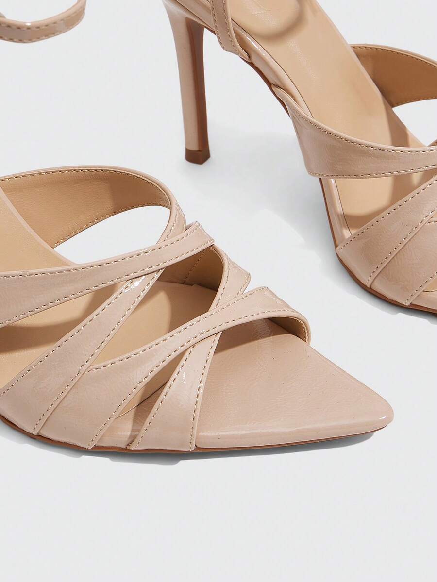 Women's open toe high stiletto sandals with cut-out cross straps and adjustable ankle buckle closure.