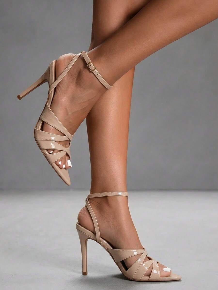 Women's open toe high stiletto sandals with cut-out cross straps and adjustable ankle buckle closure.