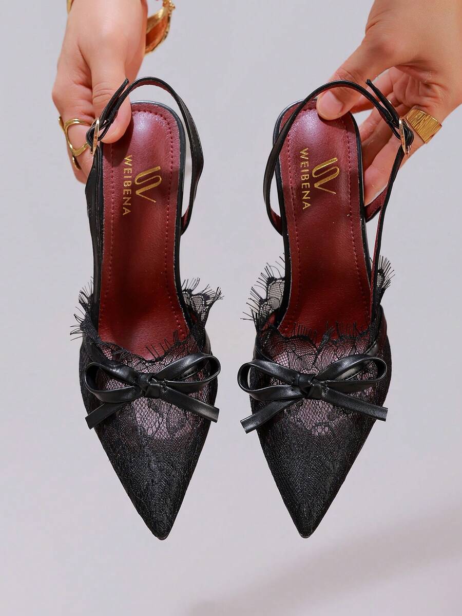 White pointed toe high heel stiletto sandals featuring lace patchwork, fringe trim, and an oversized bowknot accent.