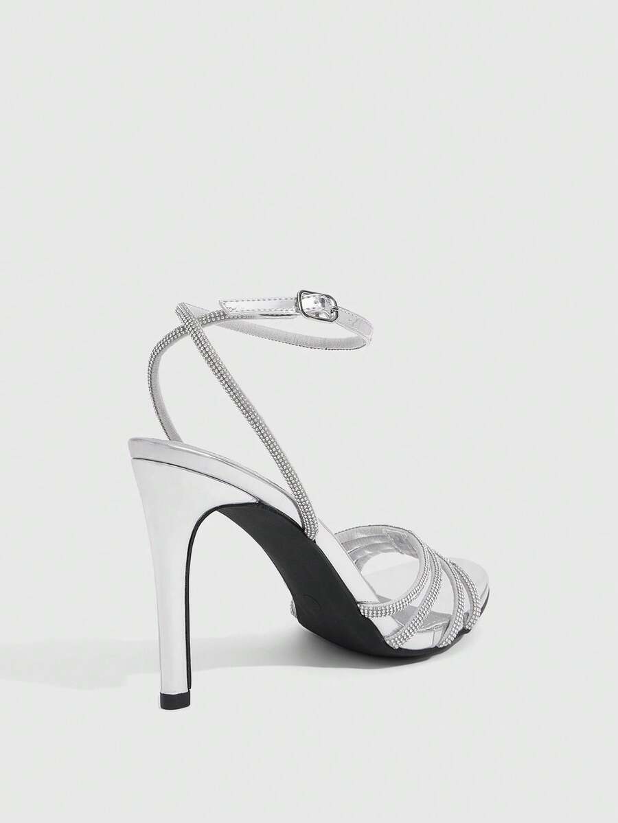 Silver rhinestone stiletto high heel sandals with open toe and adjustable ankle strap buckle