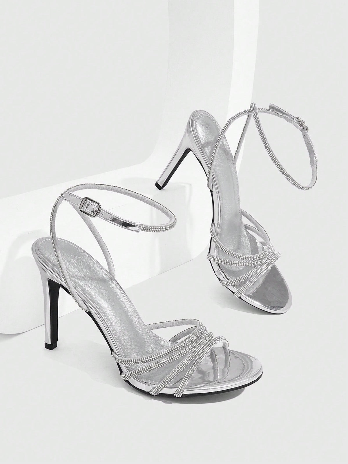 Silver rhinestone stiletto high heel sandals with open toe and adjustable ankle strap buckle