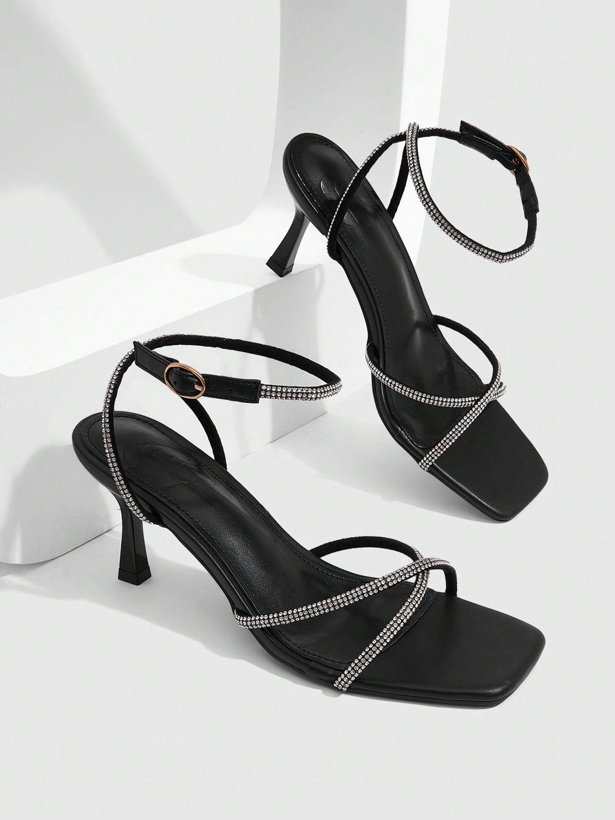 Women's open toe stiletto heel sandals featuring square toe design, criss-cross rhinestone slim straps, and secure ankle strap.