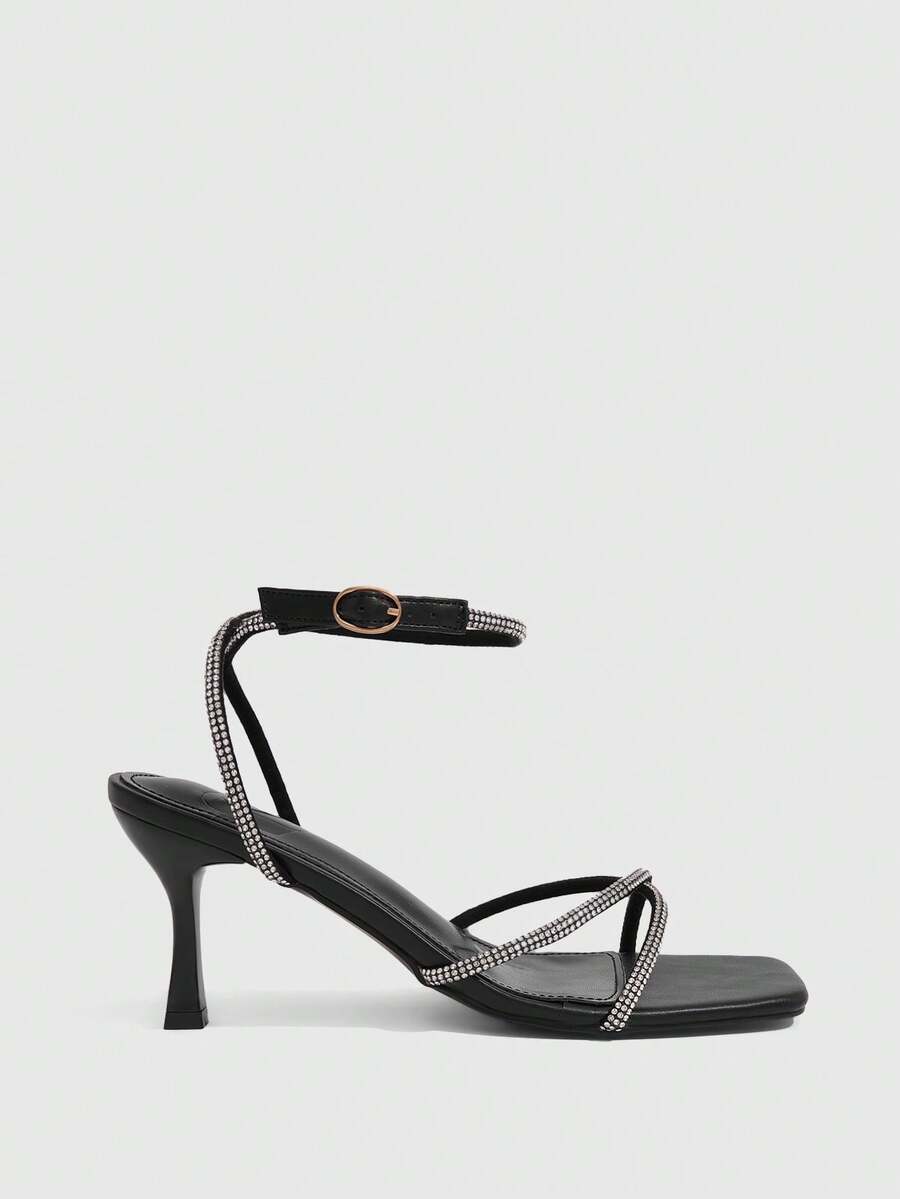 Women's open toe stiletto heel sandals featuring square toe design, criss-cross rhinestone slim straps, and secure ankle strap.