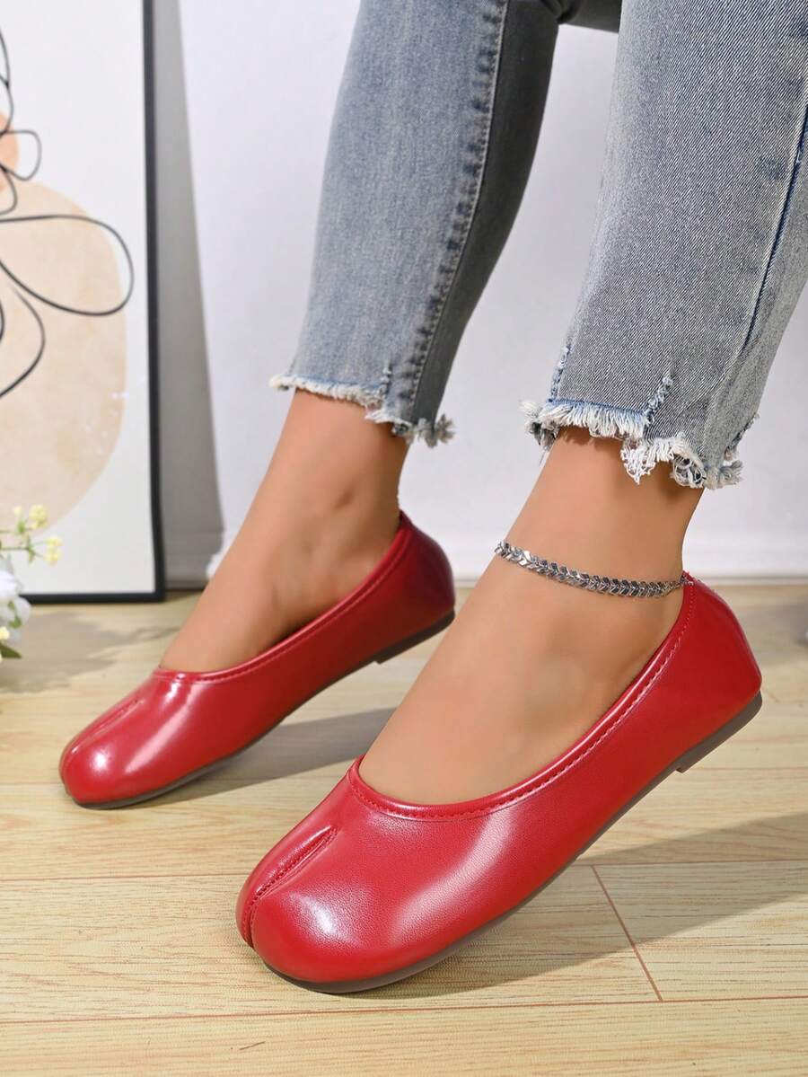 Women's white split-toe slip-on flat shoes with braided accent and rubber sole