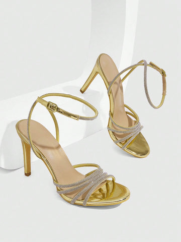 Silver rhinestone stiletto high heel sandals with open toe and adjustable ankle strap buckle