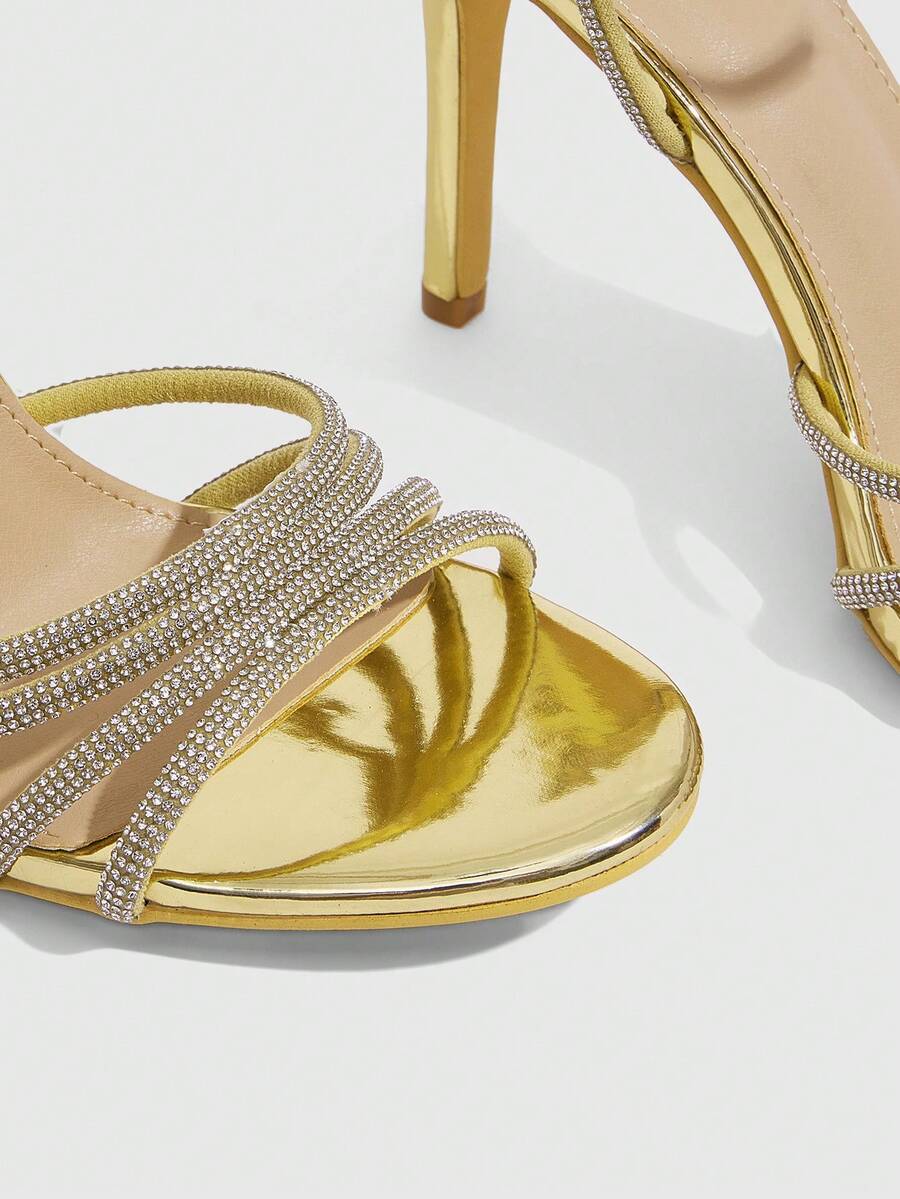 Silver rhinestone stiletto high heel sandals with open toe and adjustable ankle strap buckle