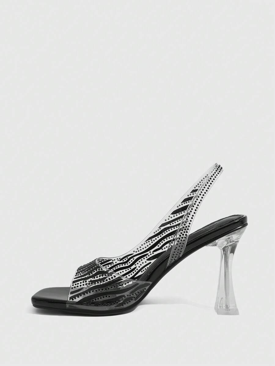 Women's square toe heeled sandals with clear straps, sparkling rhinestone embellishments, and a high pyramid heel.