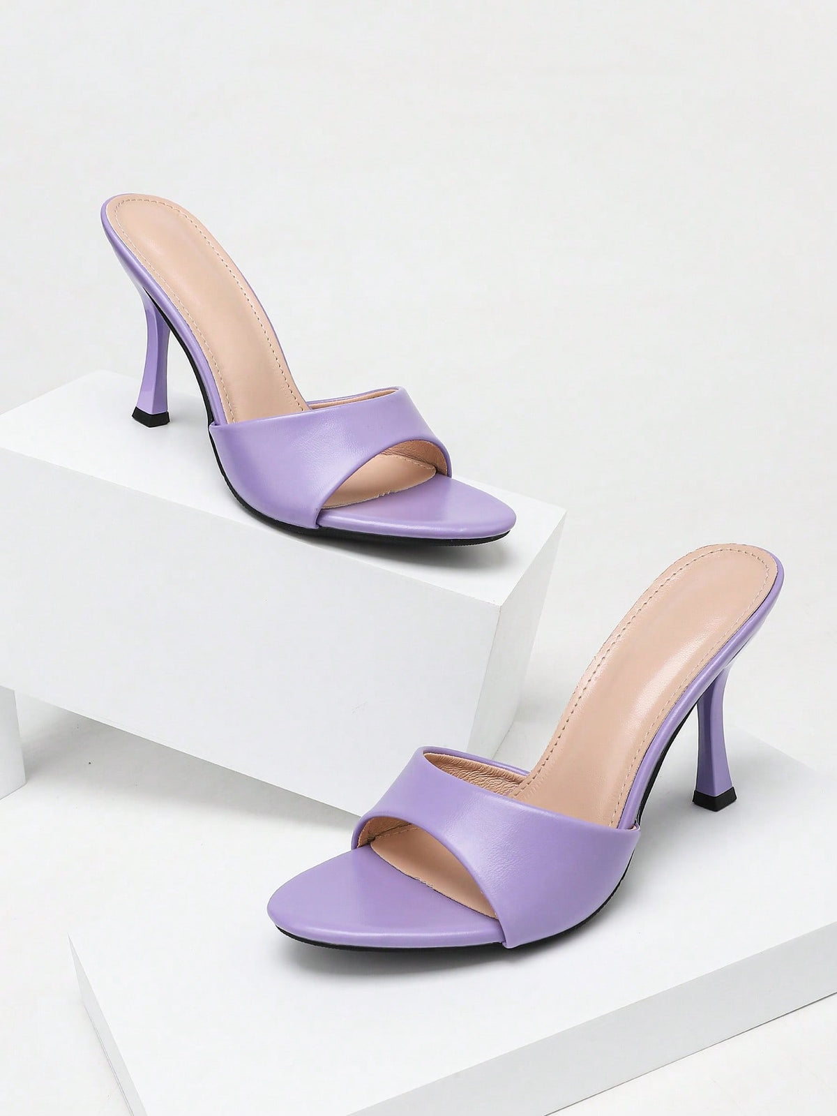 Women's stiletto high heel sandals with an open round toe and slingback strap crafted from smooth PU leather.