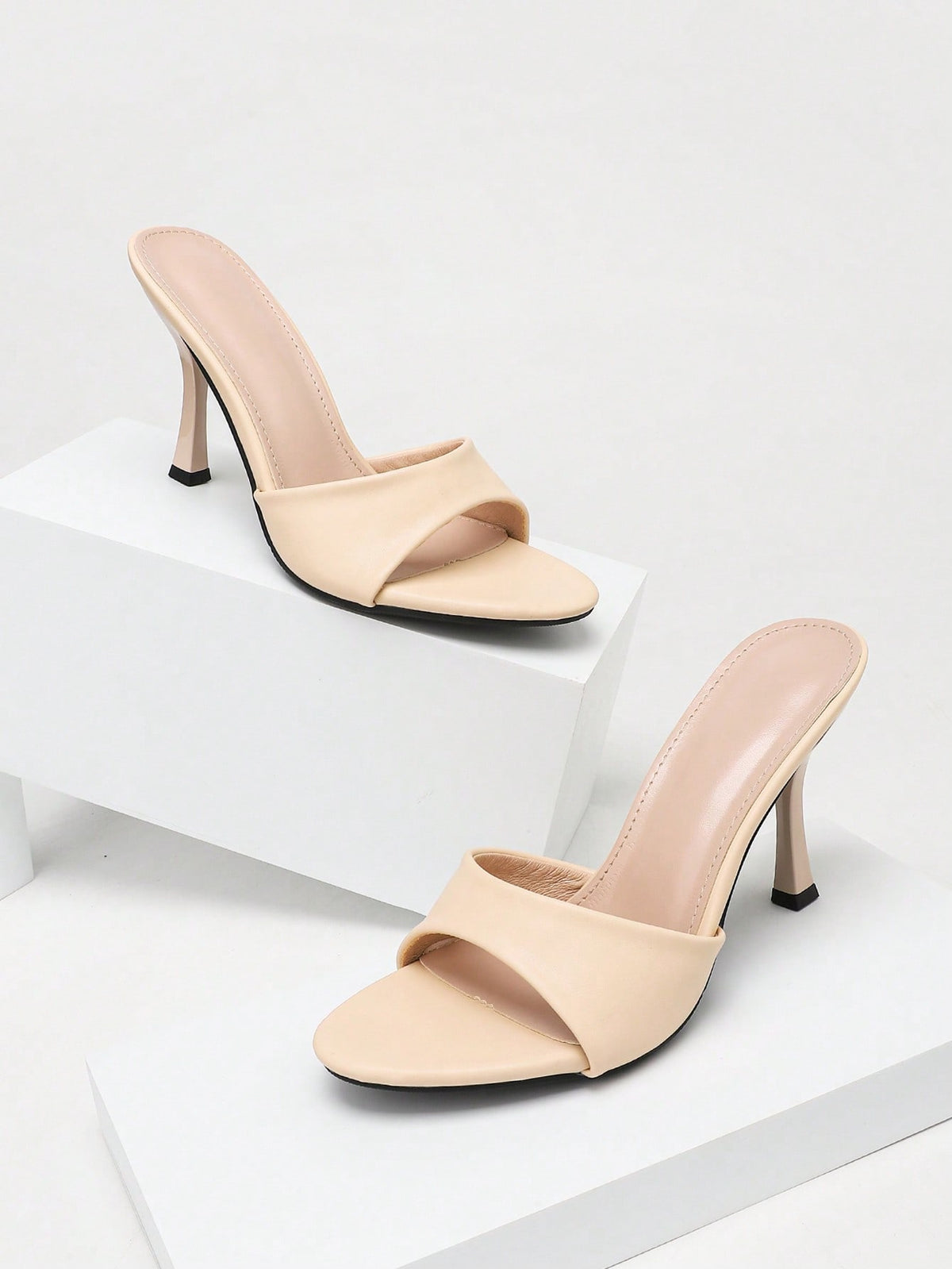 Women's stiletto high heel sandals with an open round toe and slingback strap crafted from smooth PU leather.