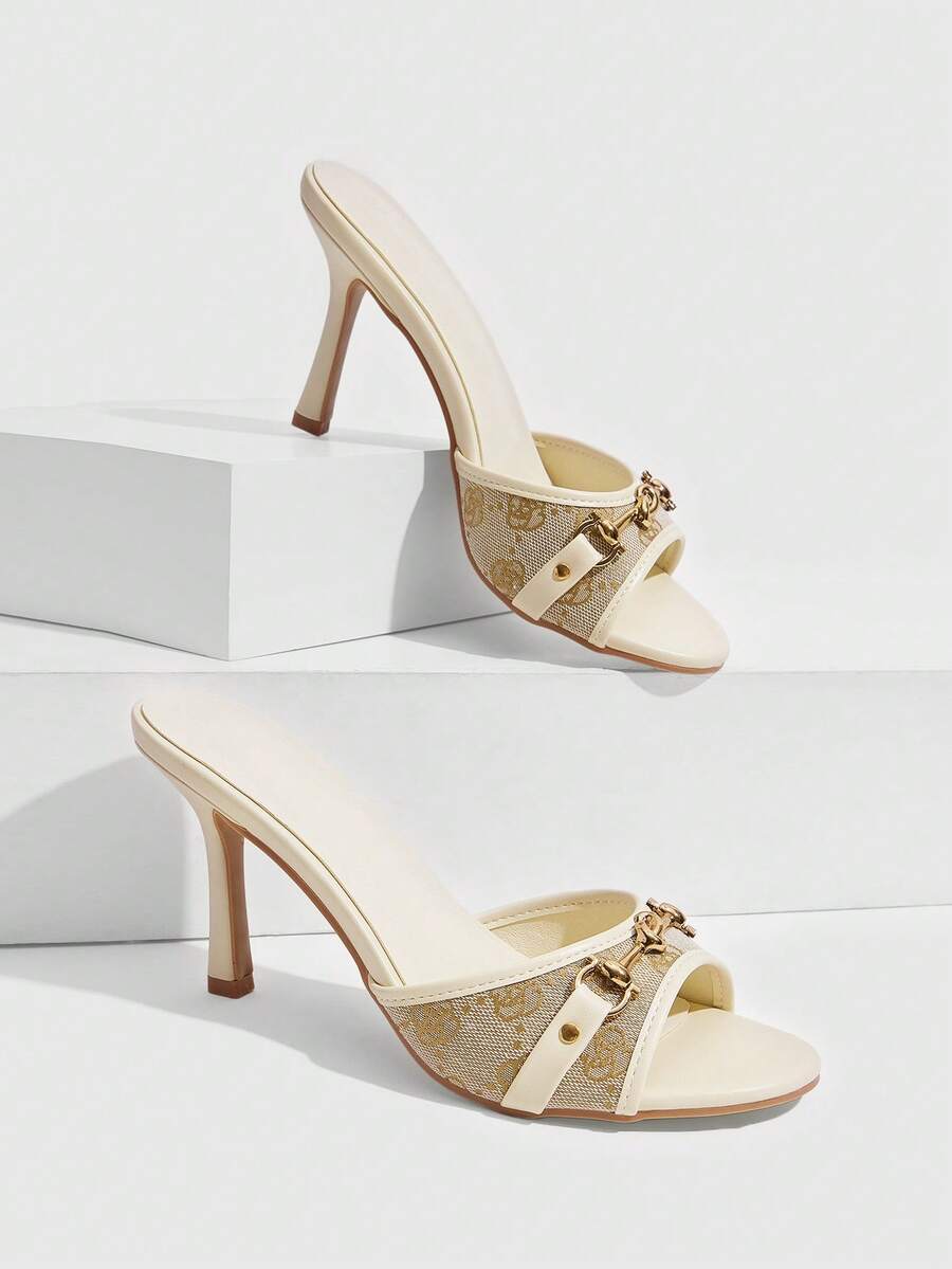 Women's beige high heel mule sandals with open round toe and metal chain detail