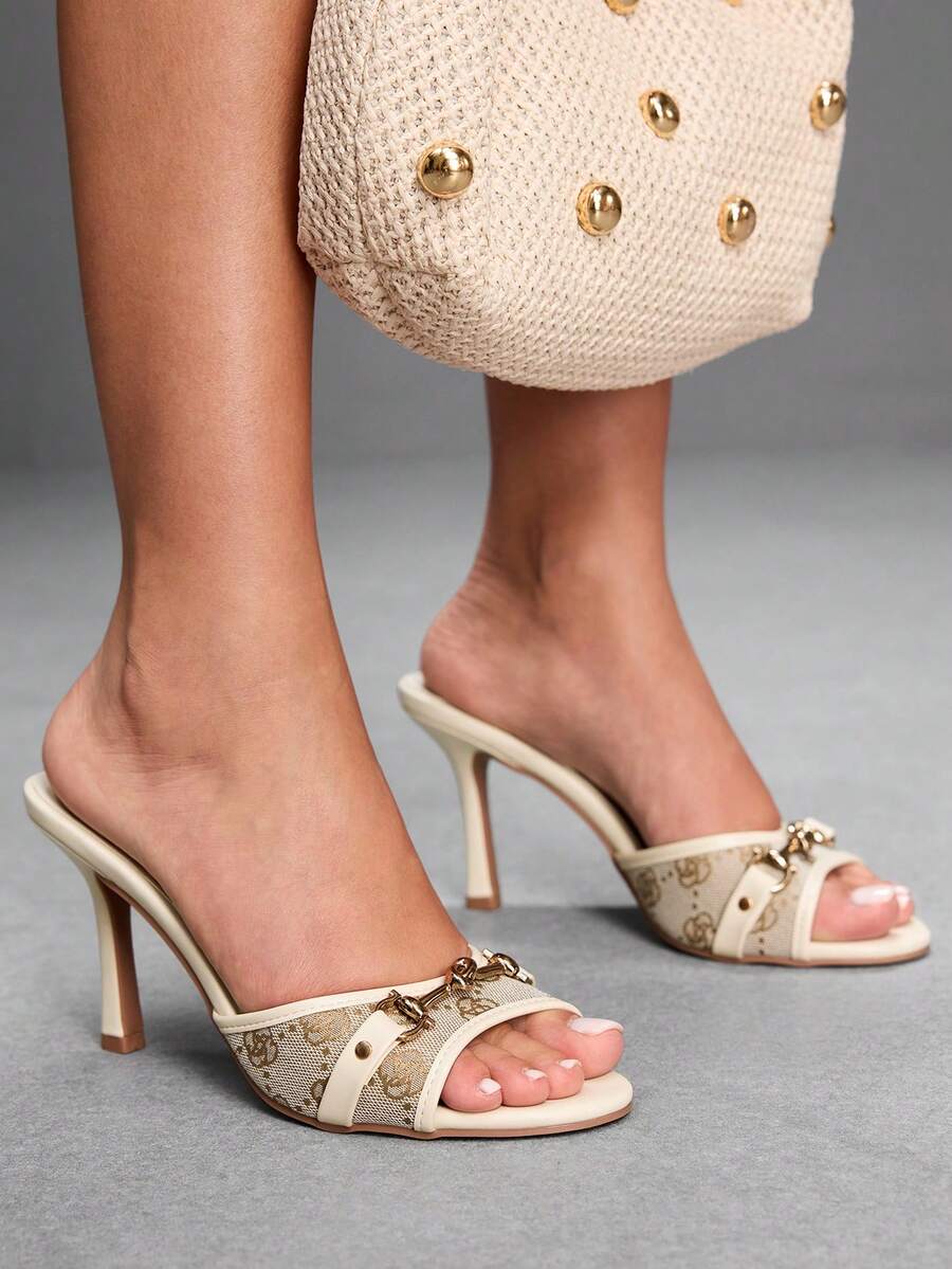 Women's beige high heel mule sandals with open round toe and metal chain detail