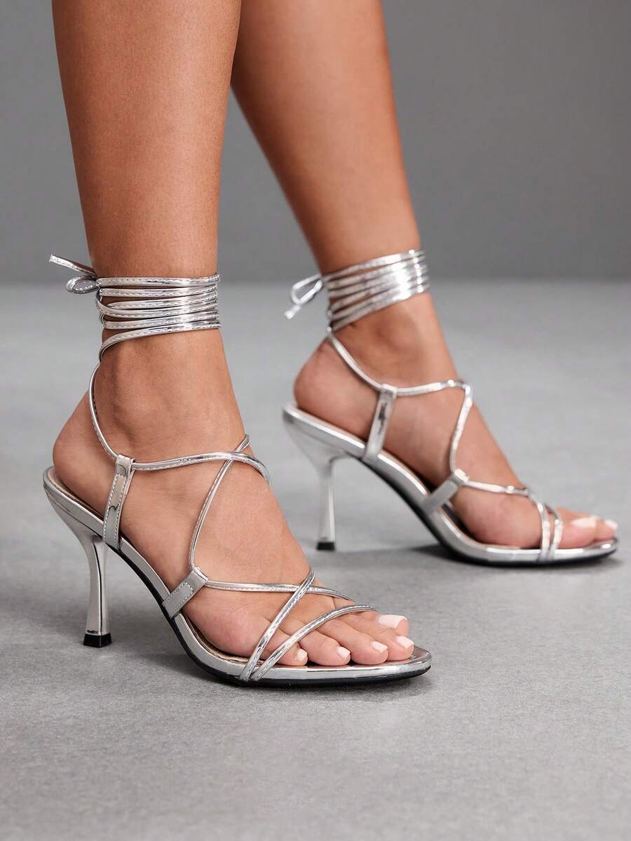Women's open toe stiletto high heel sandals with criss cross straps and sleek PU leather finish