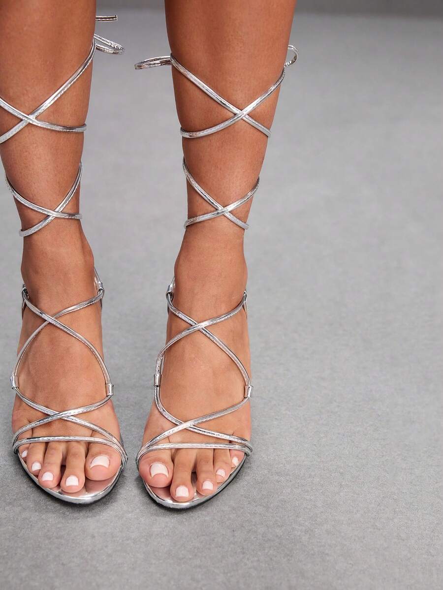 Women's open toe stiletto high heel sandals with criss cross straps and sleek PU leather finish