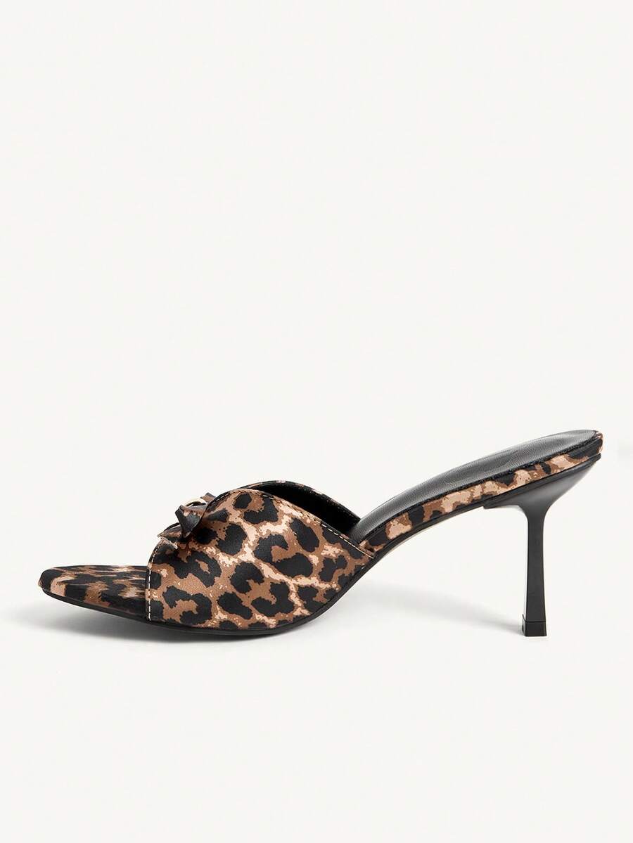 Pair of women's open toe stiletto heeled sandals crafted in satin with a bow accent