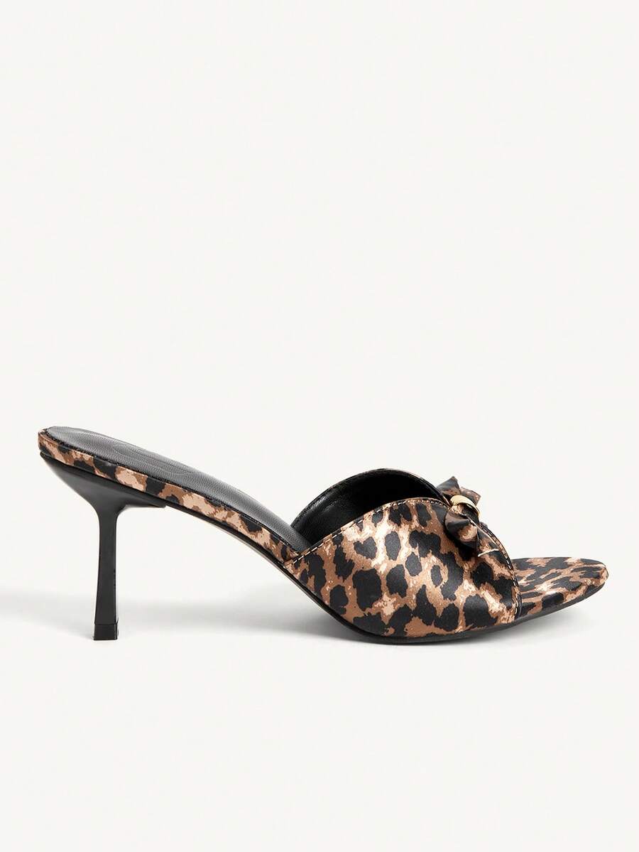 Pair of women's open toe stiletto heeled sandals crafted in satin with a bow accent