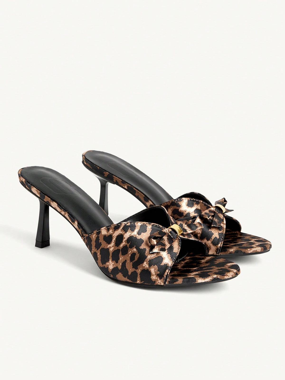 Pair of women's open toe stiletto heeled sandals crafted in satin with a bow accent
