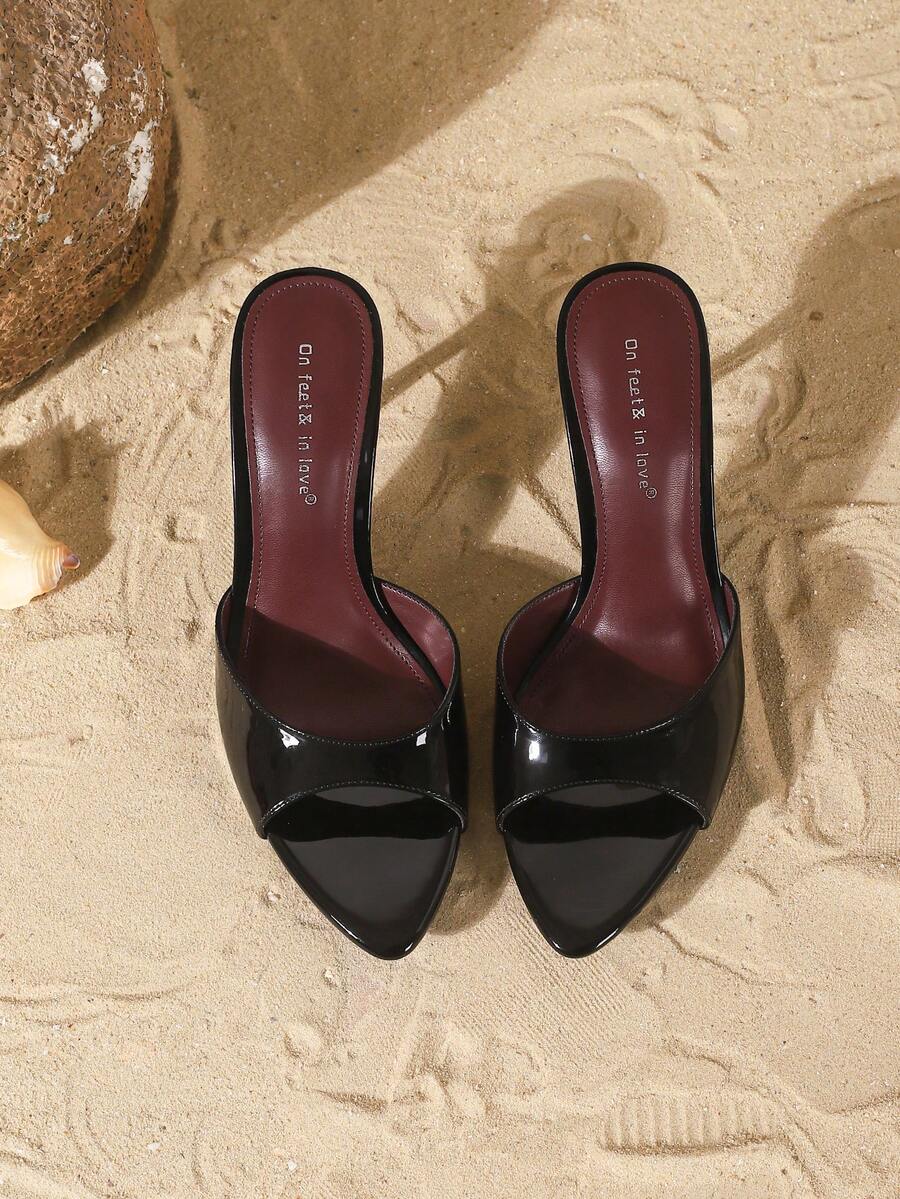 Women's open toe slide sandals featuring sleek patent leather and thin stiletto heels