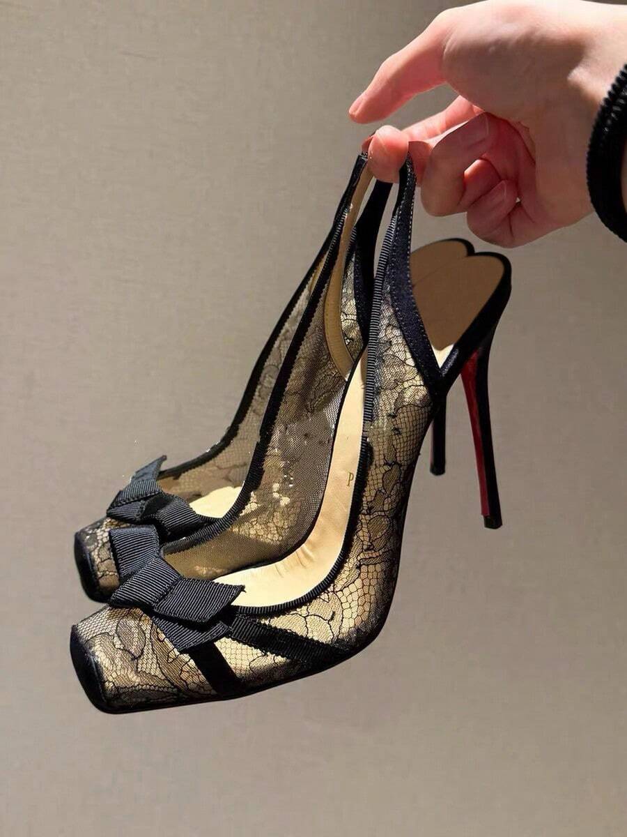 Black lace high heel sandals for women with a big bowknot, closed square toe, and stiletto heel.