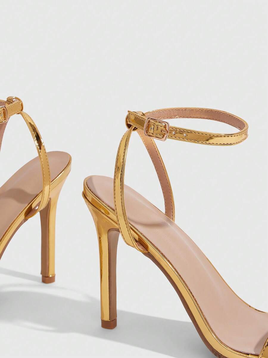 Elegant women's open toe strappy heeled sandals with stiletto high heel and ankle strap buckle closure.