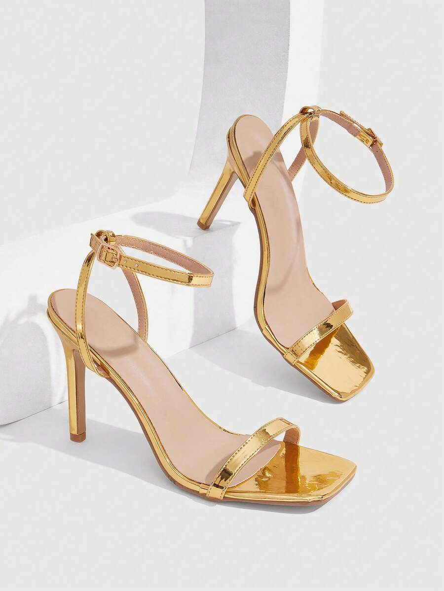 Elegant women's open toe strappy heeled sandals with stiletto high heel and ankle strap buckle closure.
