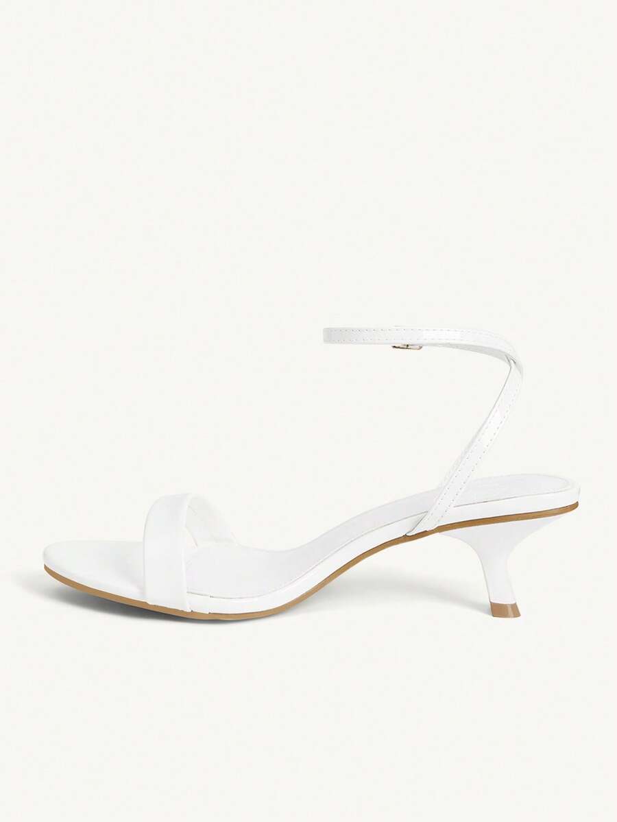 Women's open-toed high-heeled sandals featuring a 5.5cm kitten heel stiletto, sleek ankle strap with buckle closure, and smooth PU leather finish.