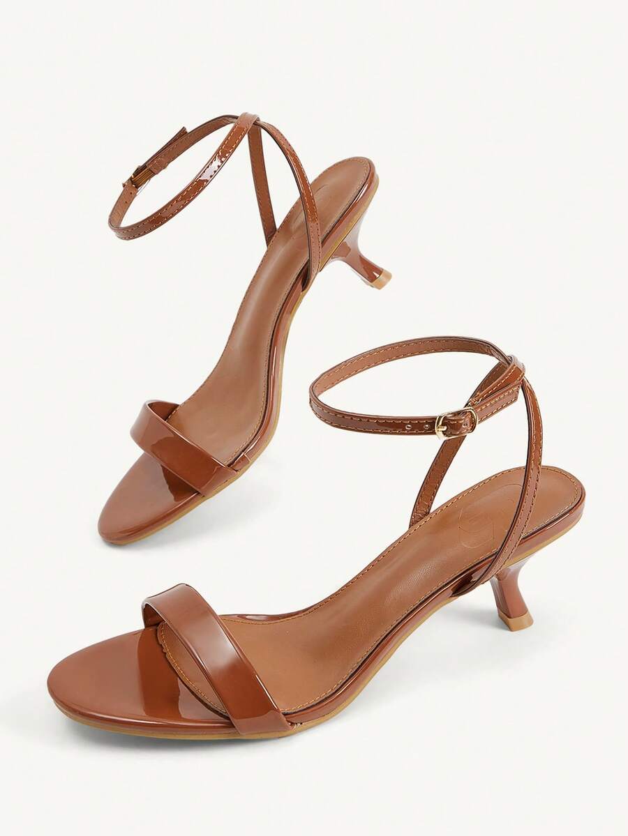 Women's open-toed high-heeled sandals featuring a 5.5cm kitten heel stiletto, sleek ankle strap with buckle closure, and smooth PU leather finish.