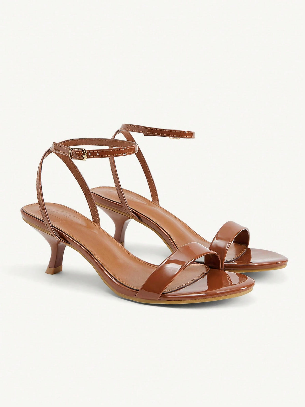 Women's open-toed high-heeled sandals featuring a 5.5cm kitten heel stiletto, sleek ankle strap with buckle closure, and smooth PU leather finish.