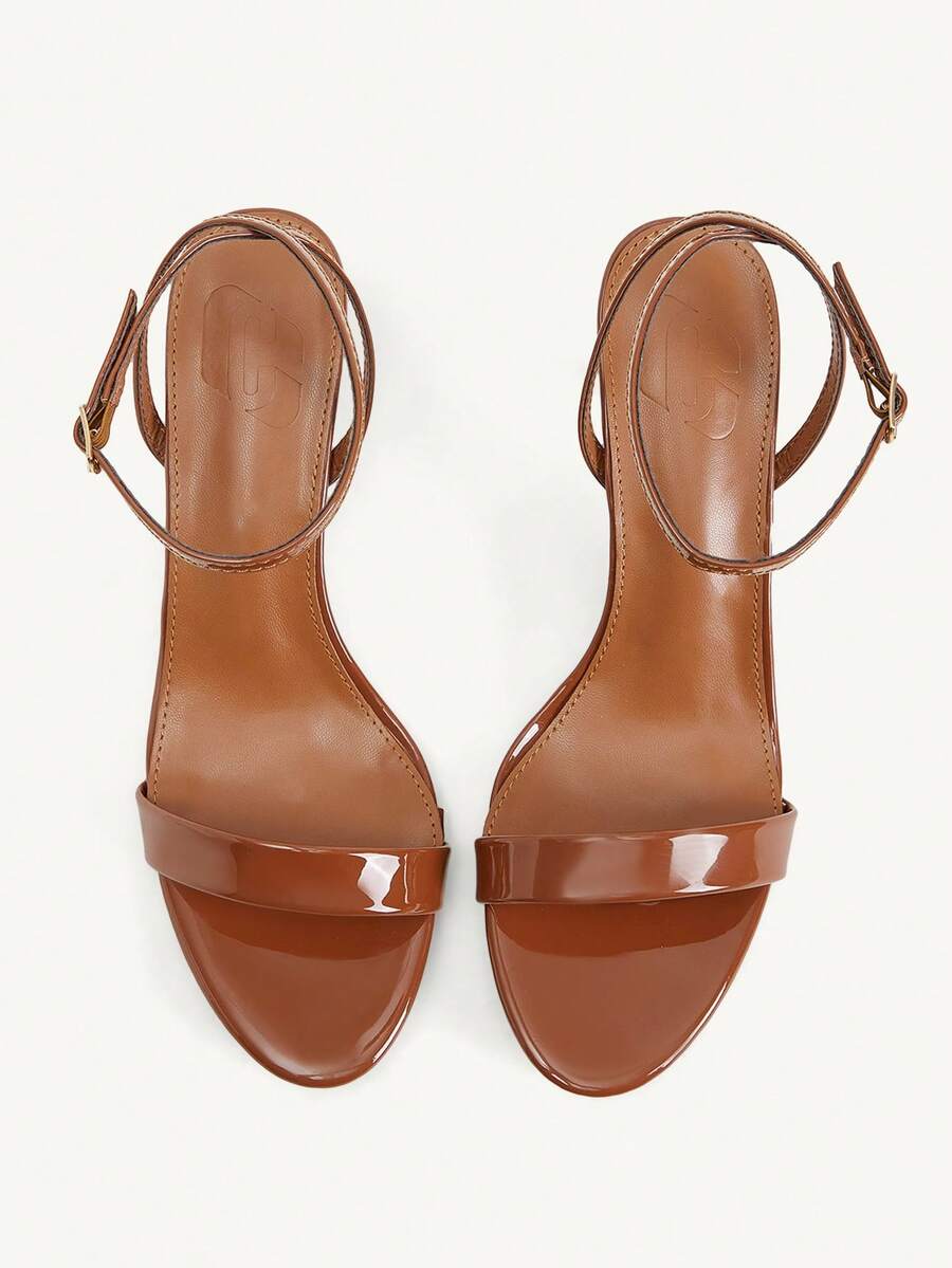 Women's open-toed high-heeled sandals featuring a 5.5cm kitten heel stiletto, sleek ankle strap with buckle closure, and smooth PU leather finish.