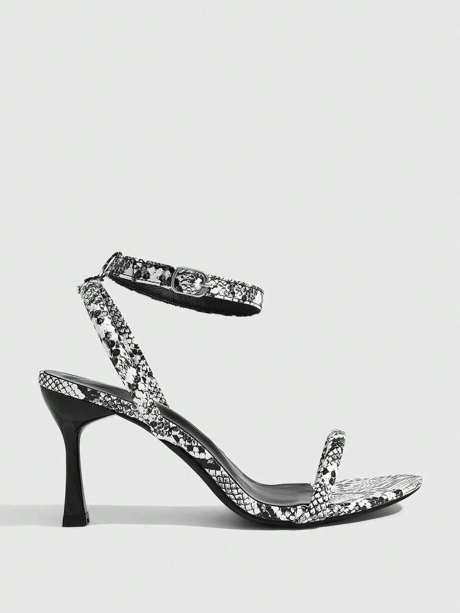 Women's open toe stiletto high heel sandals with an adjustable buckle strap and sleek PU leather finish